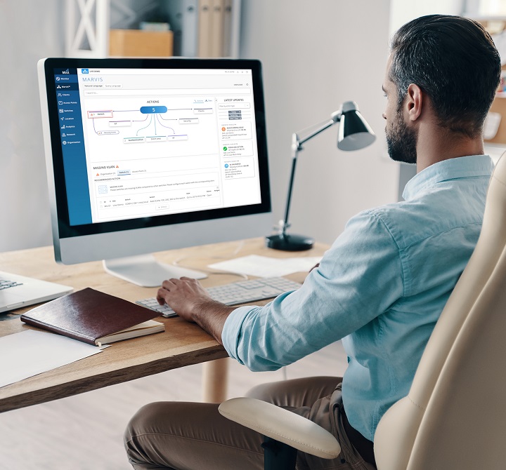 Man on computer viewing Mist screen display. 