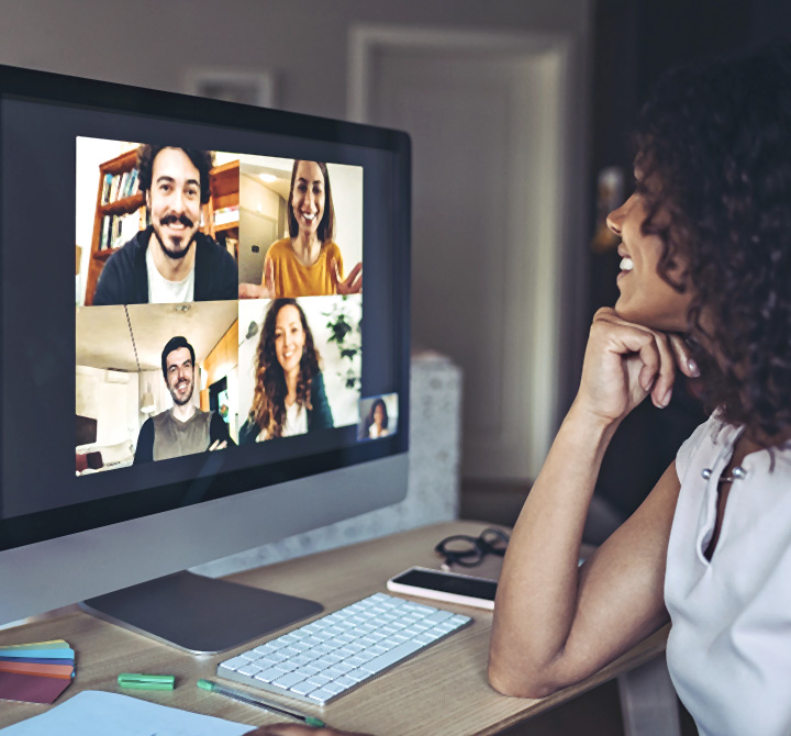 Woman working from home on her computer on a video conference. 