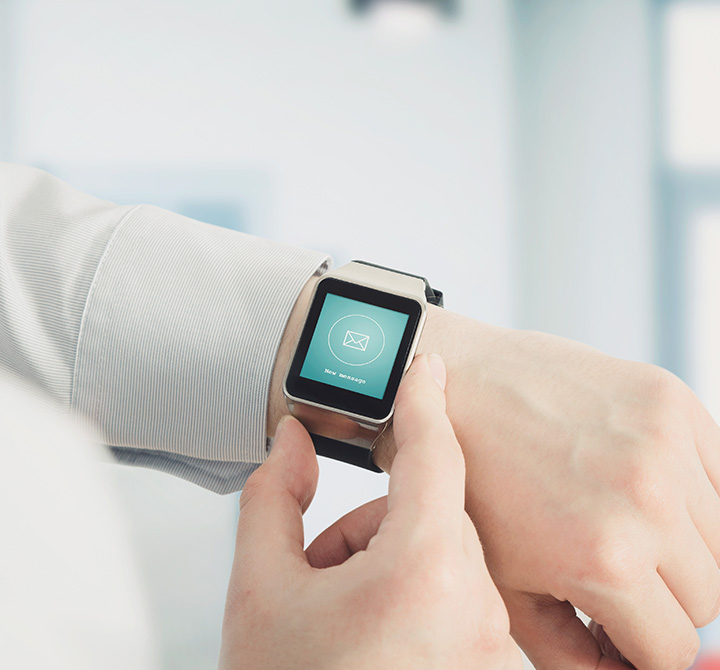 LTE enabled smart watch on wrist showing the mail sent message representing the extending the digitization