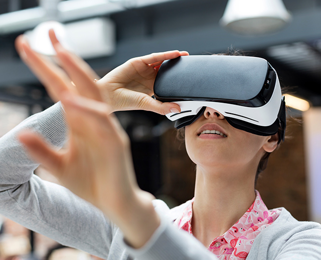 Woman using virtual reality VR device