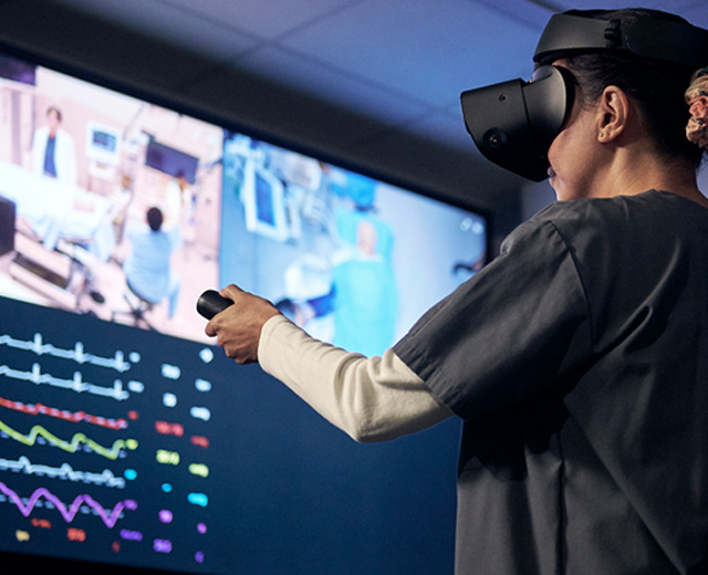 Healthcare professional using VR virtual reality goggles