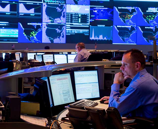 Man working on computer in NOC